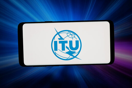 Stuttgart, Germany - 07-16-2026: In this photo illustration, the logo of International Telecommunication Union (ITU) is displayed on a smartphone in front of abstract background on computer screen.