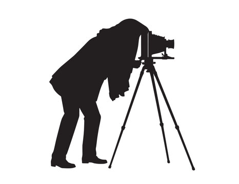 Photographer with vintage camera and tripod silhouette on a white background