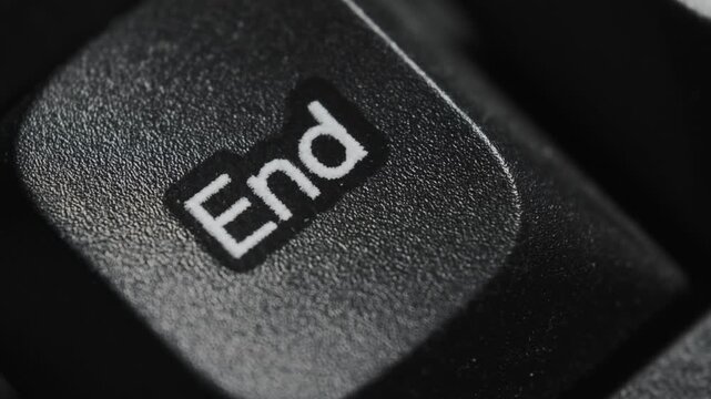 Macro view of the End key on a computer keyboard. Concept of finishing a task, project completion, and reaching the final stage.