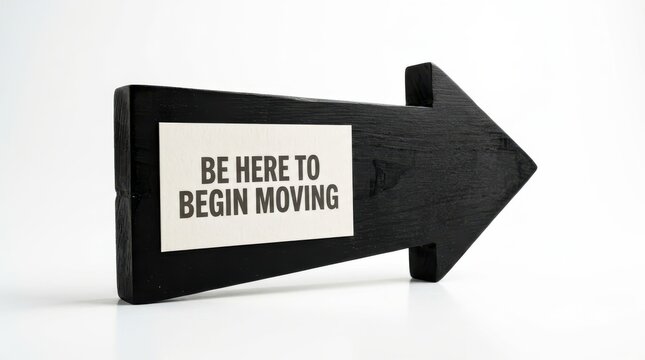 Black arrow sign with text be here to begin moving
