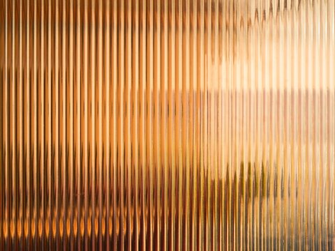 Golden orange glass texture warm abstract background pattern