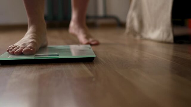 Detailed Tracking Shot of Person Stepping off Bathroom Scale