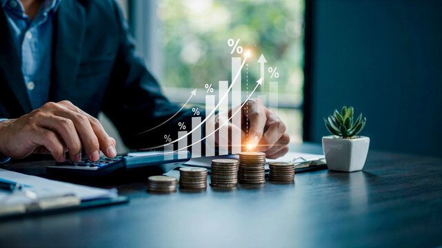 Financial analyst calculating business growth and investment profit with digital chart and coin stacks on office desk