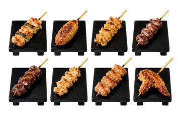 Japanese yakitori assortment featuring negima tsukune chicken skin liver hearts cartilage thigh and chicken wing skewers isolated on transparent background