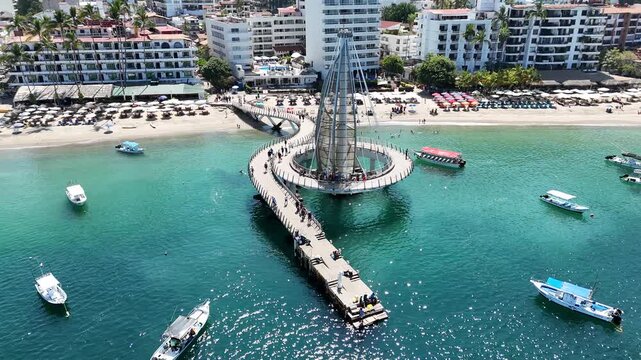 Puerto Vallarta, drone aerial 360&deg; orbit around Los Muertos Pier.