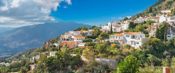Naklejka premium Scenic view of residential district with white houses on hillside in historic town of Mijas. Andalusia, Spain