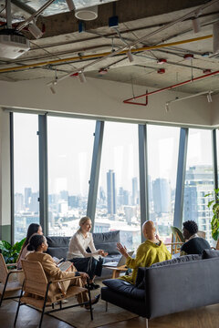 Meeting of Professionals in Modern Office With City View