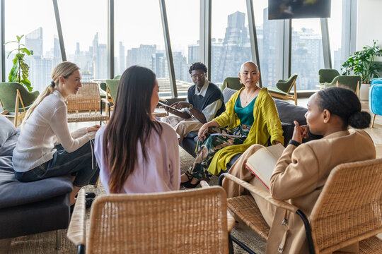 Group of People Discussing Ideas in a Modern Office Setting