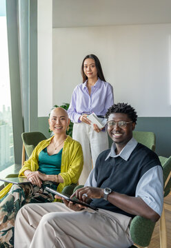 Business Team Members Pose Together in Modern Office Space