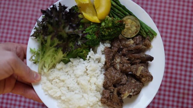 Healthy meal beef rice vegetables balanced nutrition combines grilled beef steamed rice broccoli asparagus fresh salad and peach for wholesome eating daily