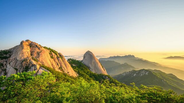 4K Time Lapse Video of Sunrise at Bukhansan Mountain and Morning Sky with Beautiful Sea of Clouds at Bukhansan National Park, Seoul, South Korea.