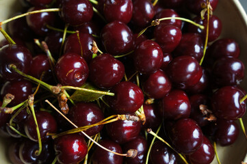 Fresh cherries in a bowl, natural light, vibrant colors, summer fruits, healthy snacks © Ella Halbreich