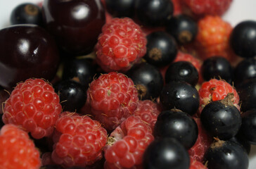 Fresh berries assortment, colorful, close-up, on a white background © Ella Halbreich