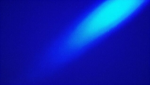 Soft focus diagonal beam of light glowing against a dark blue textured background HD video glow texture HD video