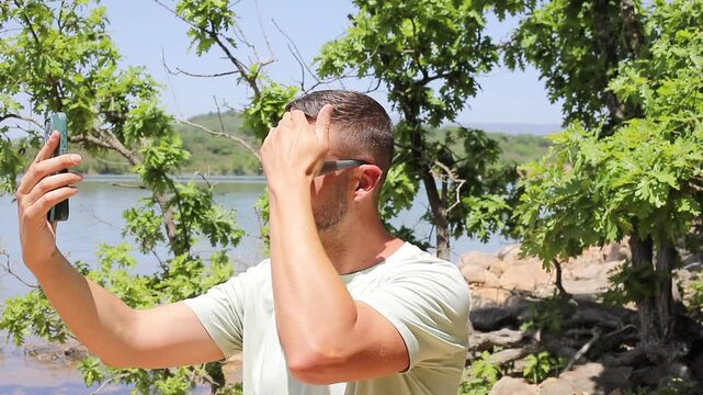Influencer filming videos from nature during the summer time 