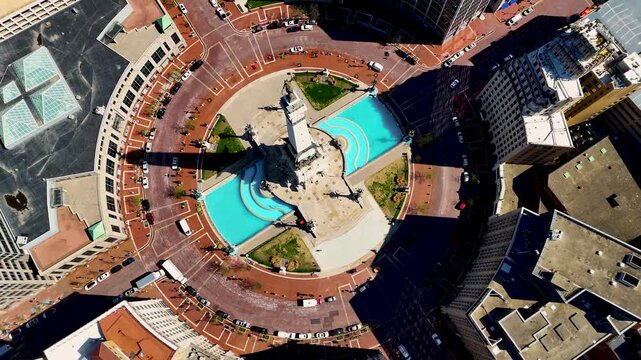 drone footage capturing the heart of Indianapolis, Indiana, showcasing its iconic skyline, contemporary architecture, commercial district, and expansive city layout from a breathtaking perspective abo