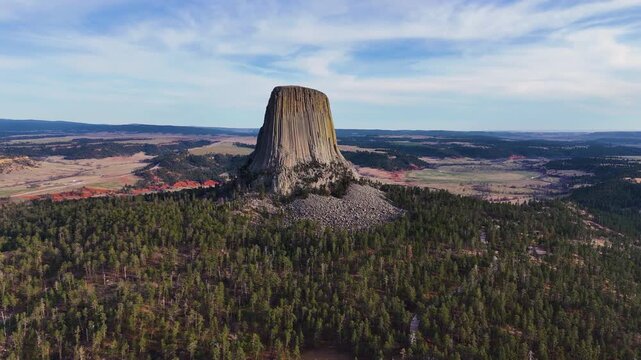 Beautiful aerial footage featuring Devils Tower in Wyoming, highlighting the massive natural rock formation, untouched wilderness, and breathtaking scenery of one of America's most recognizable nation