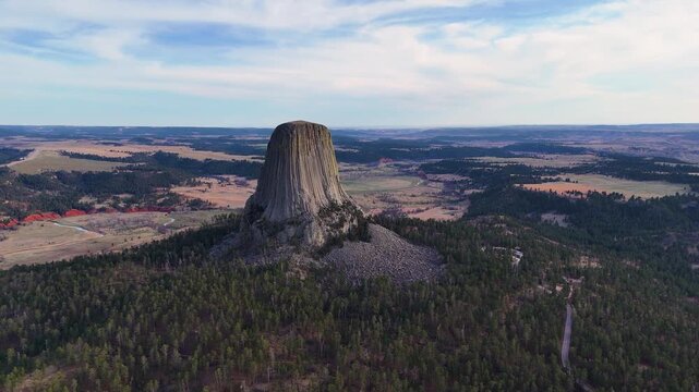 Beautiful aerial footage featuring Devils Tower in Wyoming, highlighting the massive natural rock formation, untouched wilderness, and breathtaking scenery of one of America's most recognizable nation