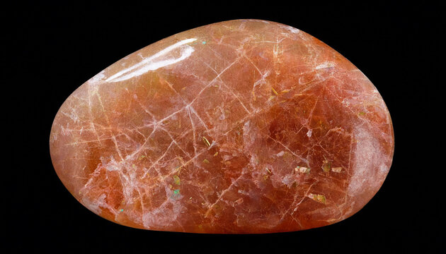 A polished sunstone gemstone with internal golden inclusions and white fractures isolated on a black background, showing its smooth texture