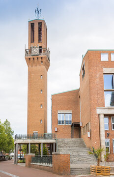 Grand brick steps ascend toward the historic clock tower of the town hall in Hengelo, Netherlands