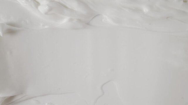Smear of natural organic body butter cream. Skincare cream texture background for beauty product promotion, hydration treatment and clean beauty aesthetic.