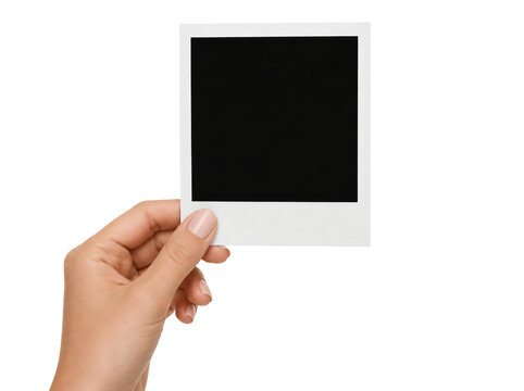 Hand holding blank polaroid photo isolated on transparent background