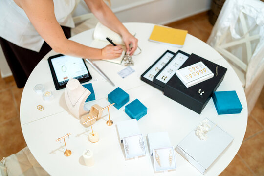 Artisan creating and organizing handcrafted jewelry for