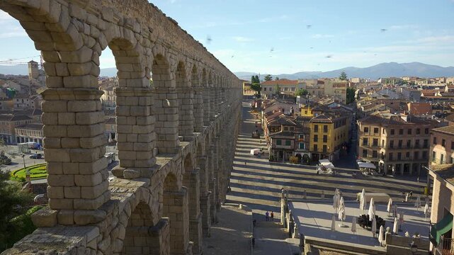 Elevated perspective along the Roman Aqueduct of Segovia overlooking the historic city center