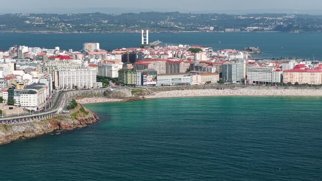 Aerial View of A Coru&ntilde;a City Peninsula, Urban Beaches, Cruise Port, and the Ancient Tower of Hercules Lighthouse in Galicia, Spain