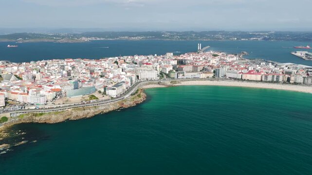 Aerial View of A Coru&ntilde;a City Peninsula, Urban Beaches, Cruise Port, and the Ancient Tower of Hercules Lighthouse in Galicia, Spain