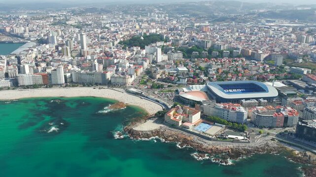 Aerial View of A Coru&ntilde;a City Peninsula, Urban Beaches, Cruise Port, and the Ancient Tower of Hercules Lighthouse in Galicia, Spain