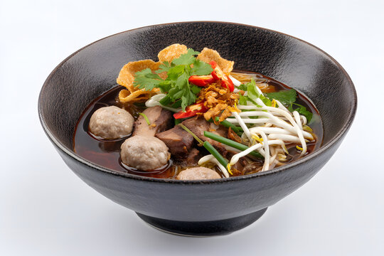 Delicious Thai Boat Noodle Dish with Meatballs, Bean Sprouts, and Aromatic Herbs on a Plate
