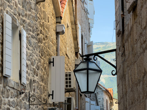 Charming fragment of a historic old street with traditional lanterns, atmospheric European architecture and timeless urban atmosphere