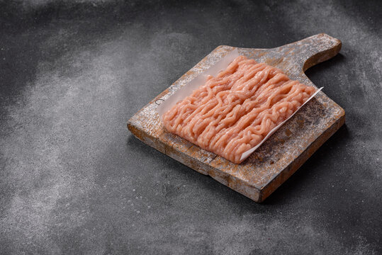Fresh raw ground chicken, poultry meat for home cooking. Ground chicken