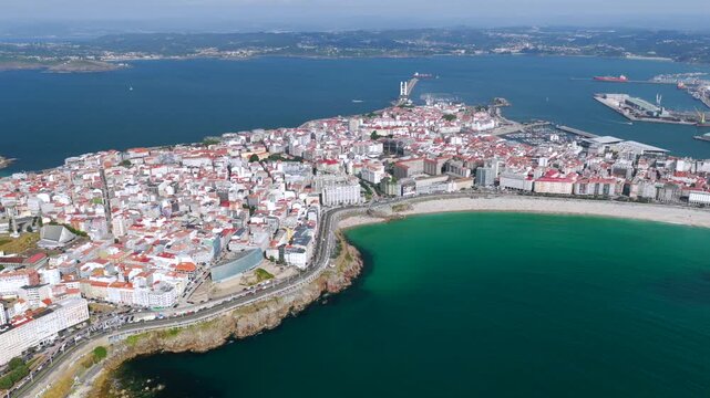 Aerial View of A Coru&ntilde;a City Peninsula, Urban Beaches, Cruise Port, and the Ancient Tower of Hercules Lighthouse in Galicia, Spain