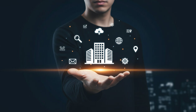 Professional worker holding digital building icon with smart interface.