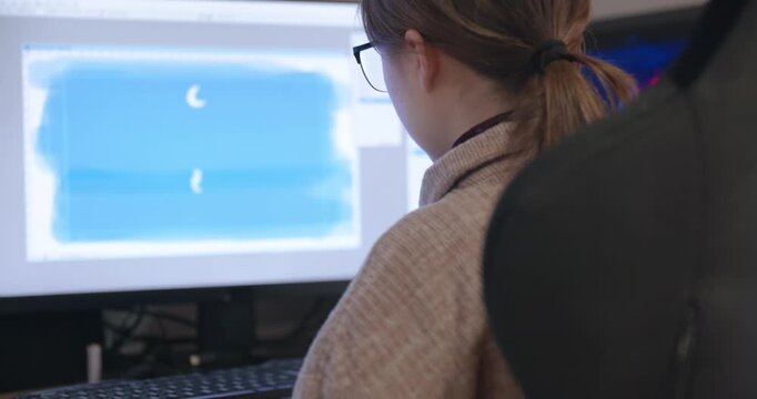 Girl with Glasses Drawing Picture on Desktop Computer Monitor. 4K 10-bit