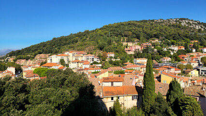 La Turbie village houses on a lush hillside in Provence-Alpes-Cote d'Azur, France, Europe. La Turbie village houses with terracotta roofs climbing a green hillside, Maritime Alps, France, Europe. © Iryna Shpulak