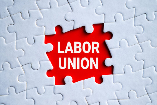 Labor Union red puzzle piece on white jigsaw background, workers rights and collective bargaining employment concept
