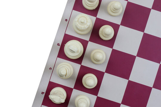 Top view of white chess pieces on a chessboard with copy space