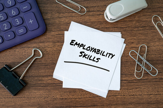 Employability Skills text on paper cards with calculator and clips on wooden desk, career development and HR concept