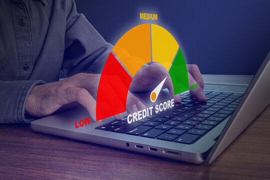 Person using laptop with credit score gauge meter showing low to high rating, financial assessment and banking concept