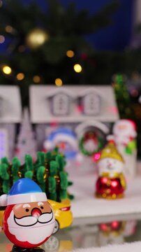 A quirky Santa Claus jumps ahead of a Christmas town