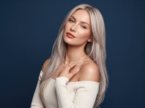 Navy backdrop frames a gray blonde haired girl