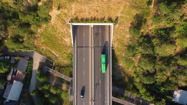 Aerial video of the road leading into a tunnel. Beautiful drone footage of the road into the tunnel.