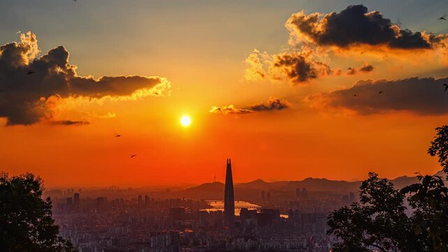 4K time-lapse video of a summer sunset view of Seoul, where you can see Lotte World Tower, Han River, and N Seoul Tower from Namhansanseong Fortress, South Korea.