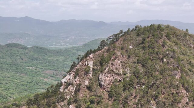 Mountain rock peak on wild landscape background aerial drone view