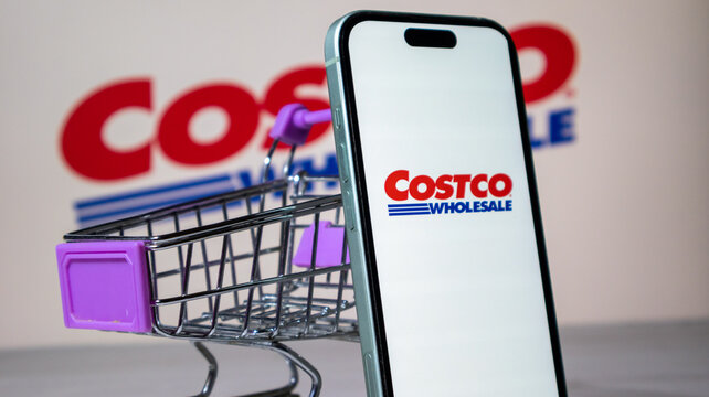 Costco wholesale shopping concept with miniature cart and smartphone.