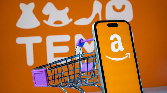 Amazon logo displayed on smartphone screen with Temu background and shopping cart.