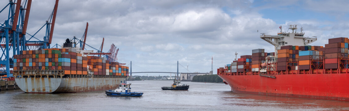 Container Ship, Tugboat and Gantry Cranes at Altenwerder Terminal in Hamburg Harbor